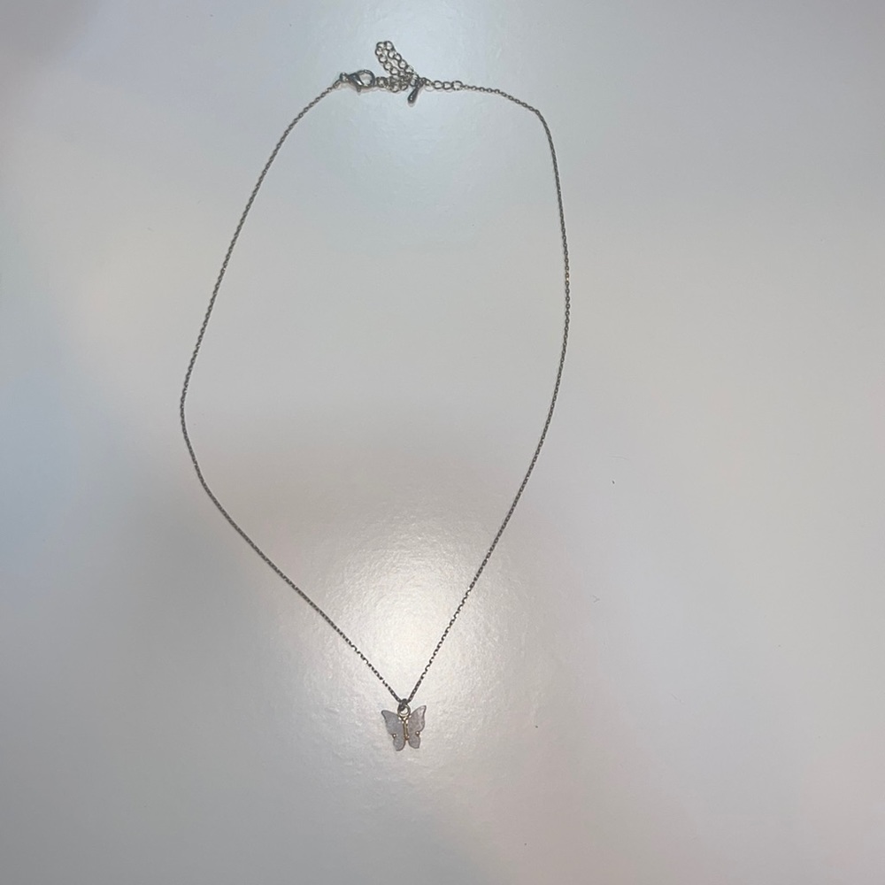 Gold necklace with white quartz butterfly